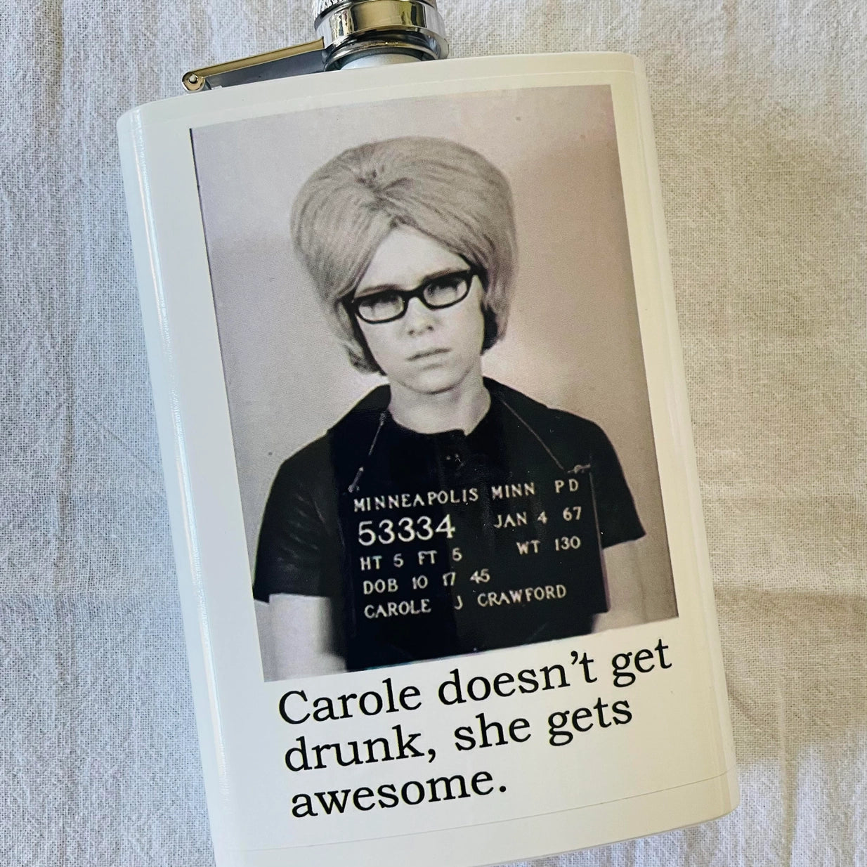 Carole doesn't get drunk, she gets awesome mugshot flask