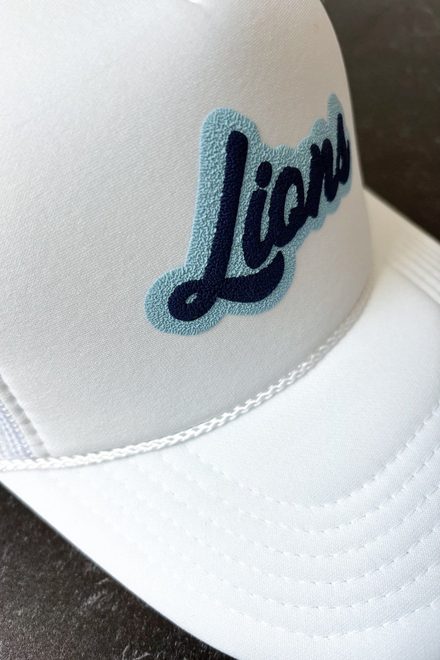 Lions Script Trucker Hat | White